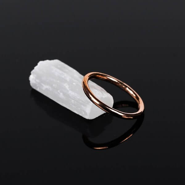 plain copper ring on white crystal