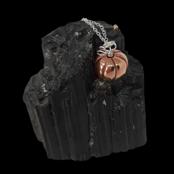 copper pumpkin necklace on black crystal