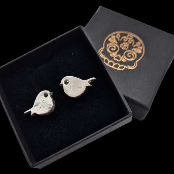Silver robin earrings in a jewellery box