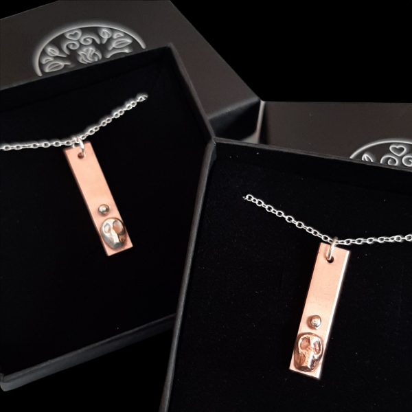 mini mori necklaces in copper and silver