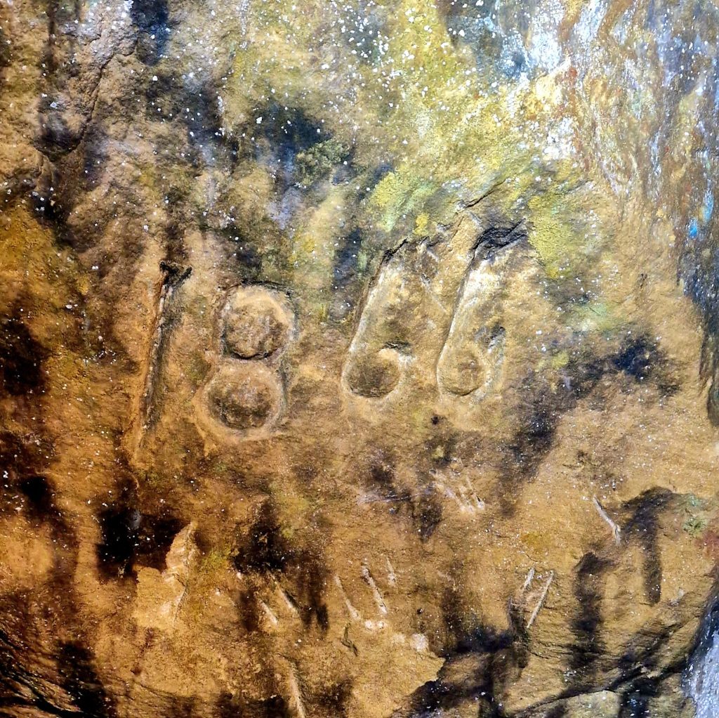 cave wall with 1866 scratched into it