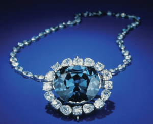 picture of a blue diamond surround by smaller white diamonds - the hope diamond