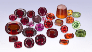 various different colours of garnet gems all grouped together in a rainbow effect