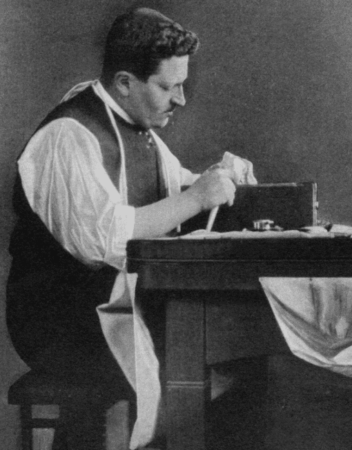 a black and white photograph of Joseph Asscher a diamond cutter working at his work bench