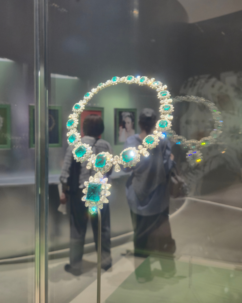 Large emerald and diamond necklace in a museum display case