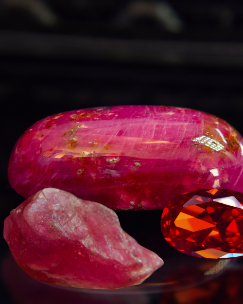 3 red crystals on a black background