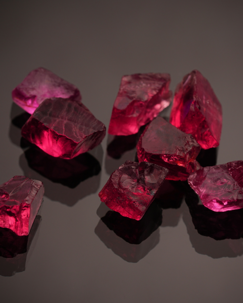 small red crystals on a black background
